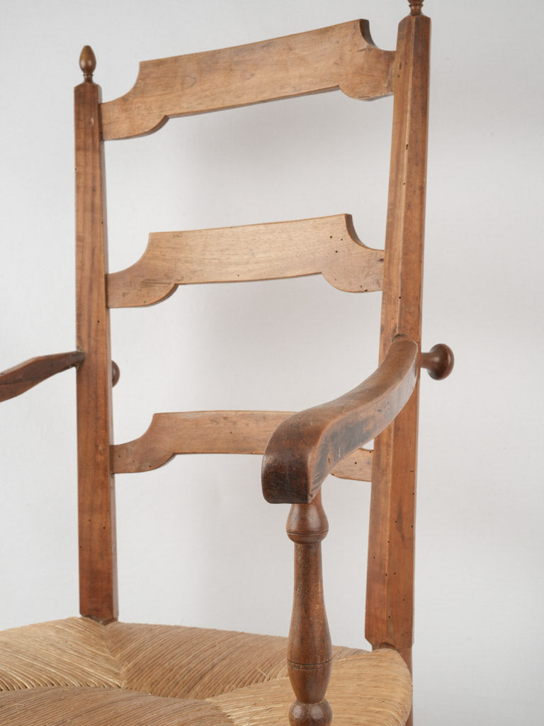 Aged French cherry wood armchair