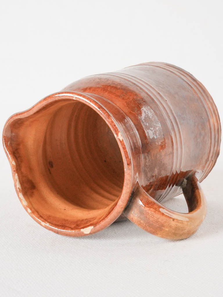 Traditional beige-toned water heating vessel