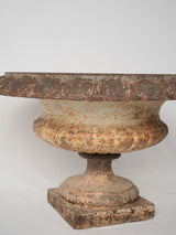 Weathered brown iron antique urns