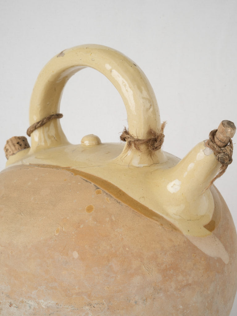 Rustic pale yellow glazed pitcher  