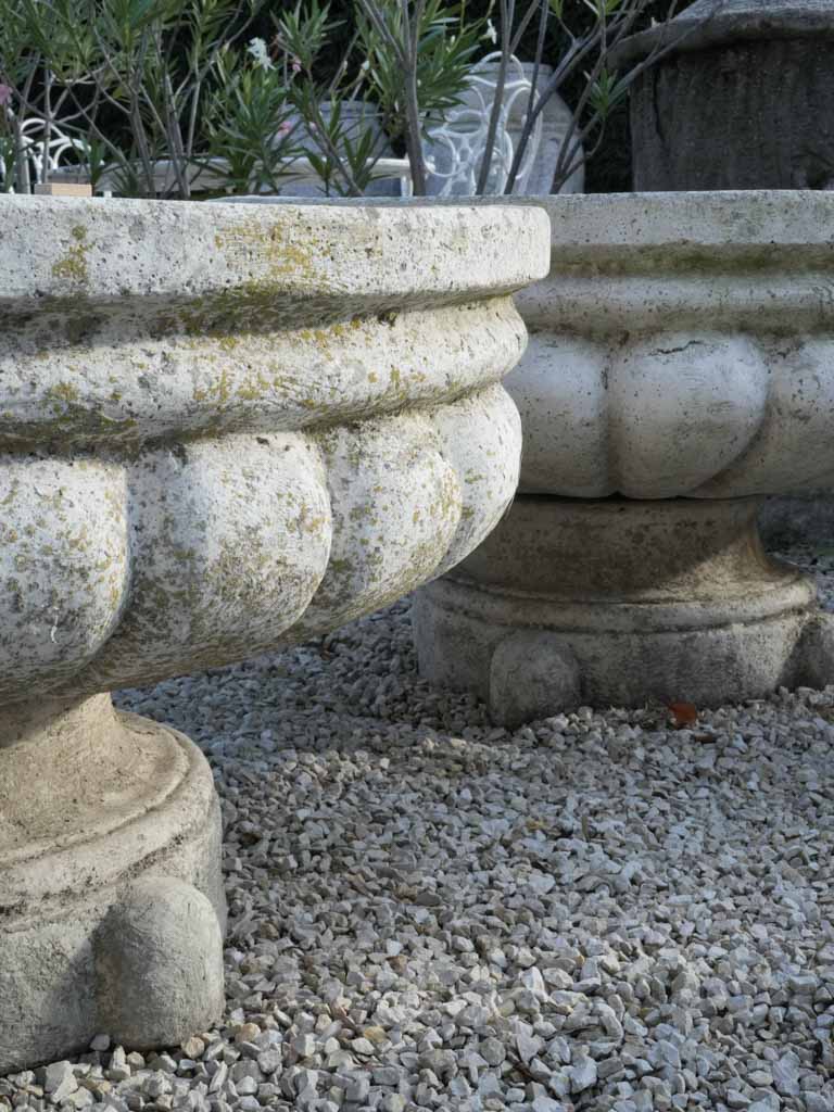 Broad gadrooned stone urn planters