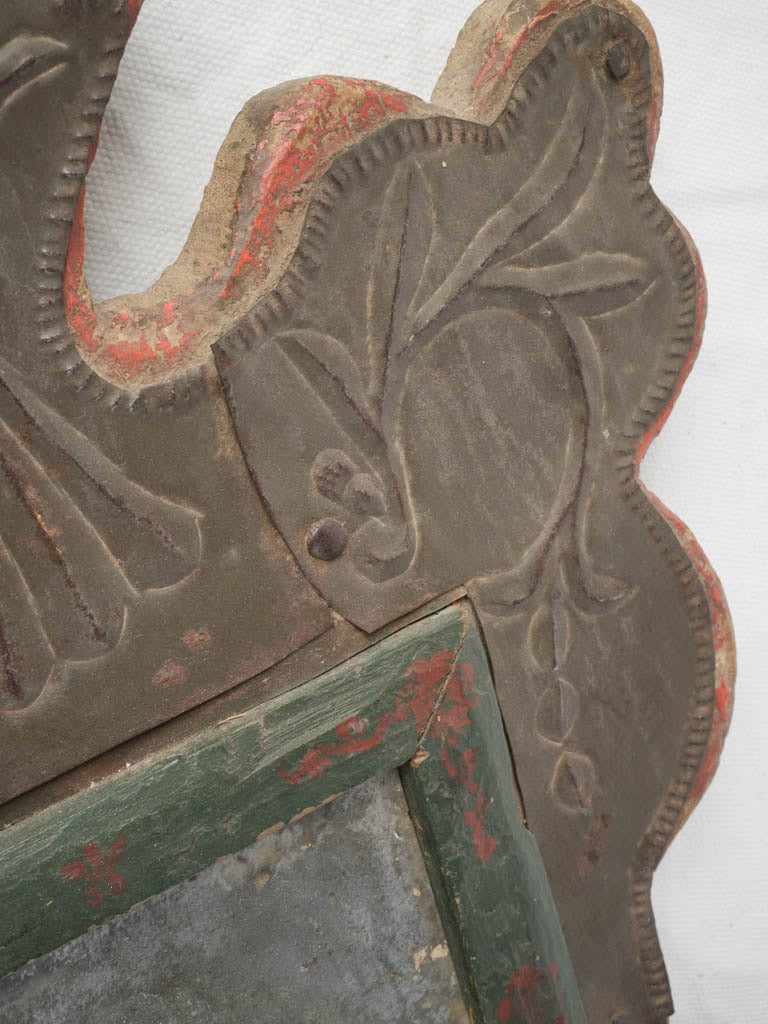 Historic chased metal folk mirror