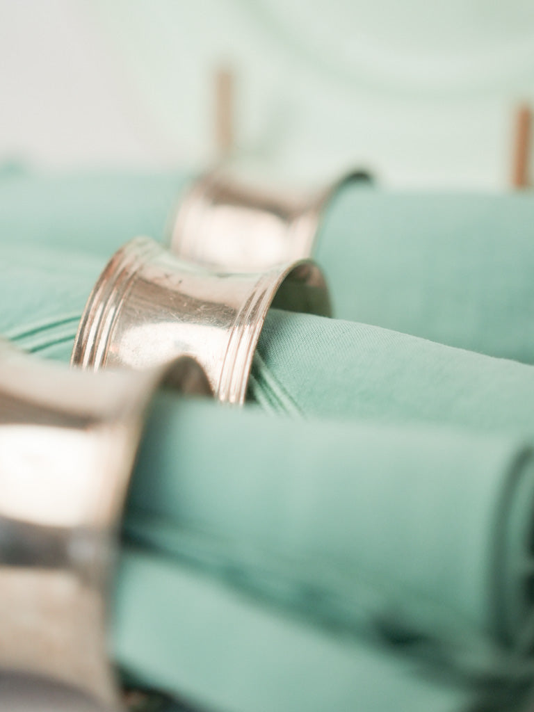 Curated, silver-plated napkin rings assortment