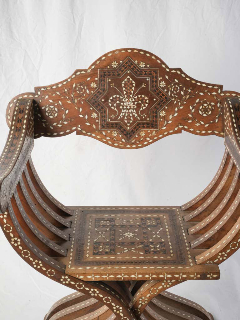 Curule-structured designer chair