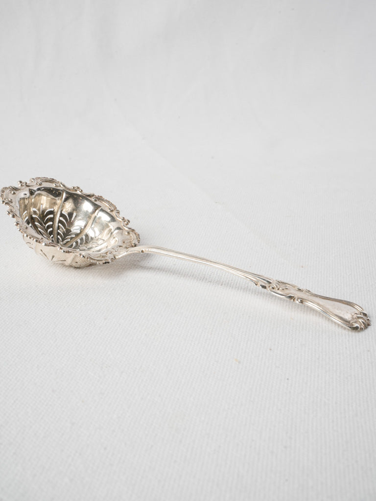 Delicately pierced antique sifter  