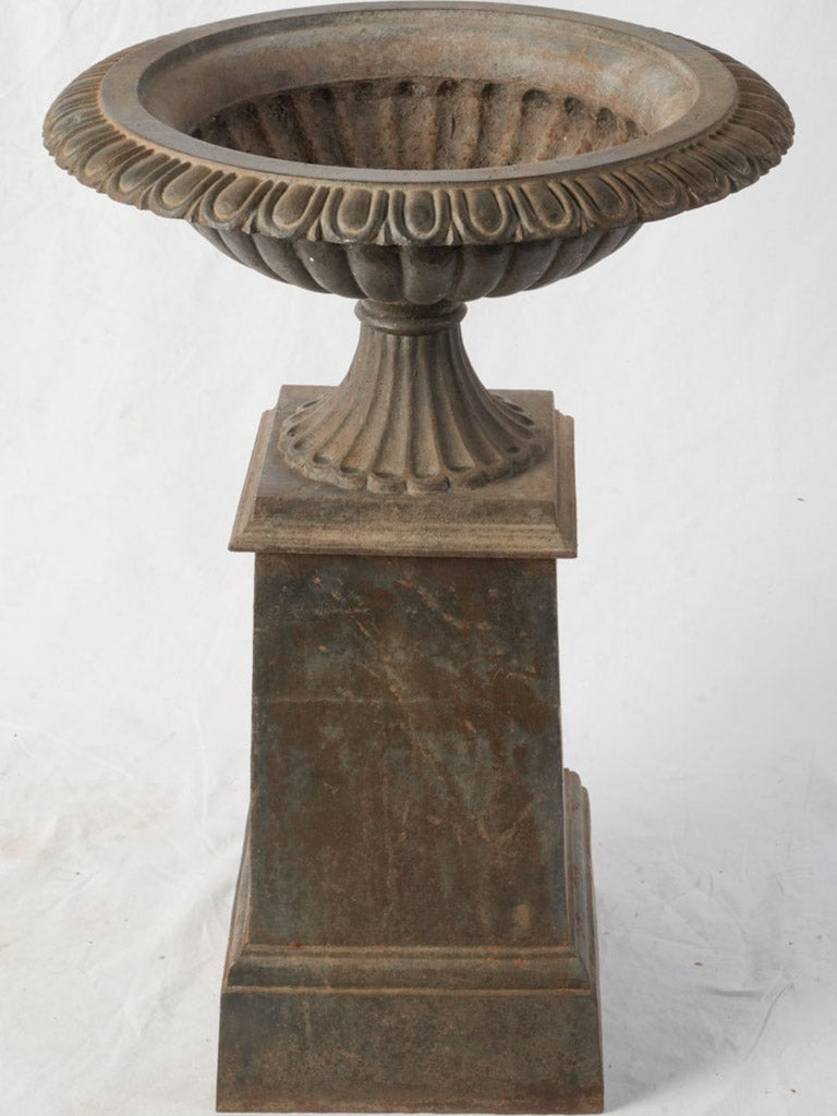 Elegant fluted socle garden urn