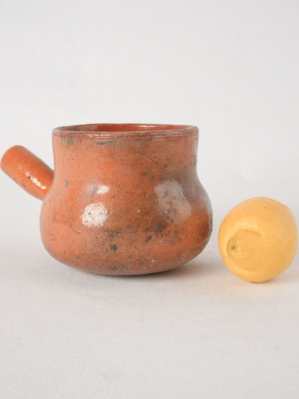 Timeworn stovetop glazed earthenware casserole