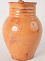 Ocher pitcher w/ ribbing at top 8"
