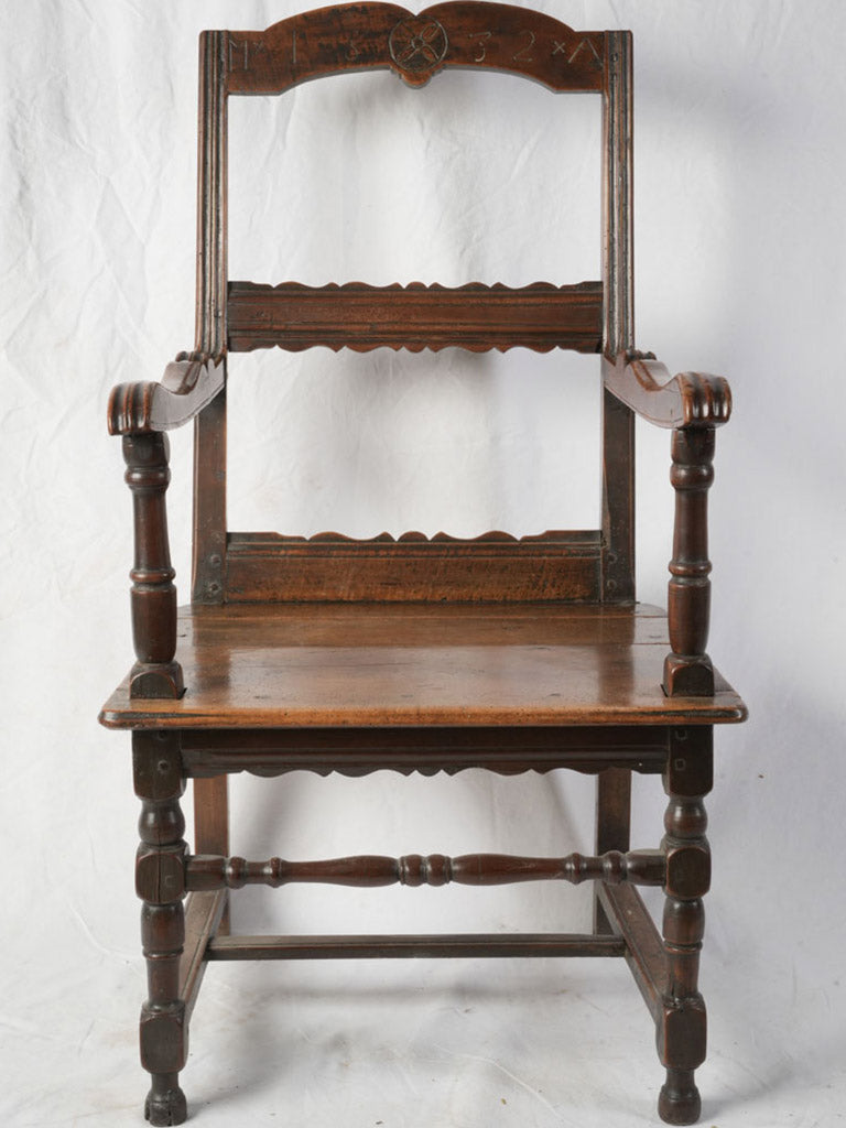 Timeworn walnut chair inscribed crest  
