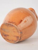 Ocher pitcher w/ ribbing at top 8"