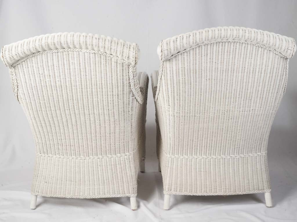 Rolled scrolled armchairs