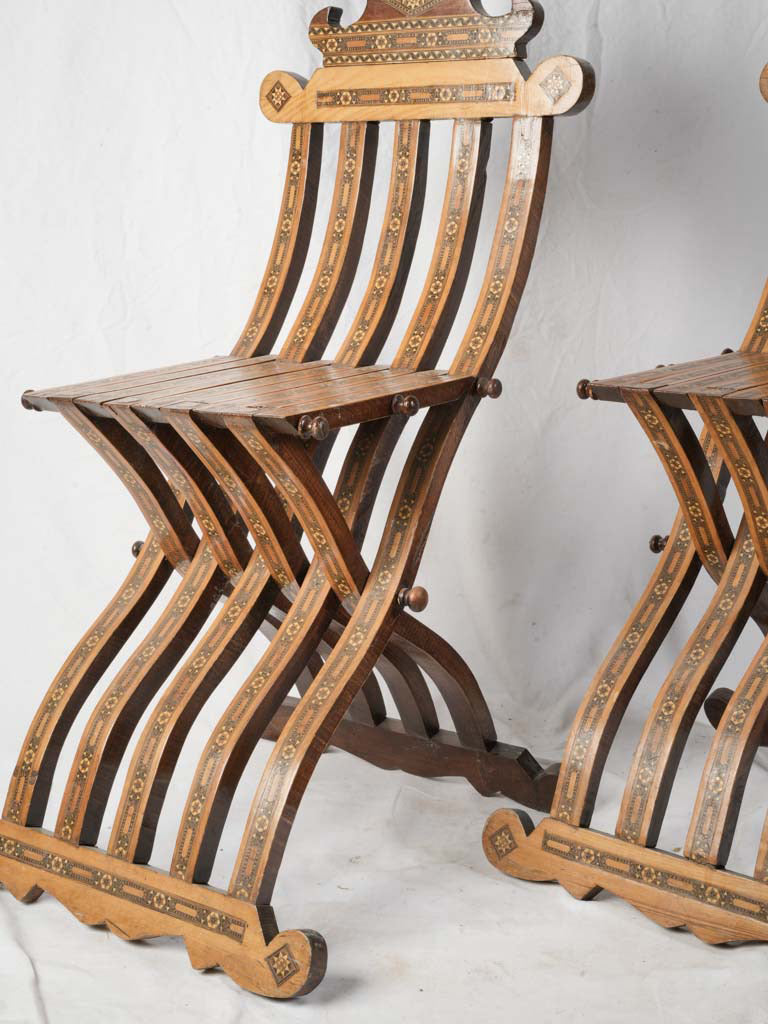 Sculptural honey-toned Savonarola chairs  