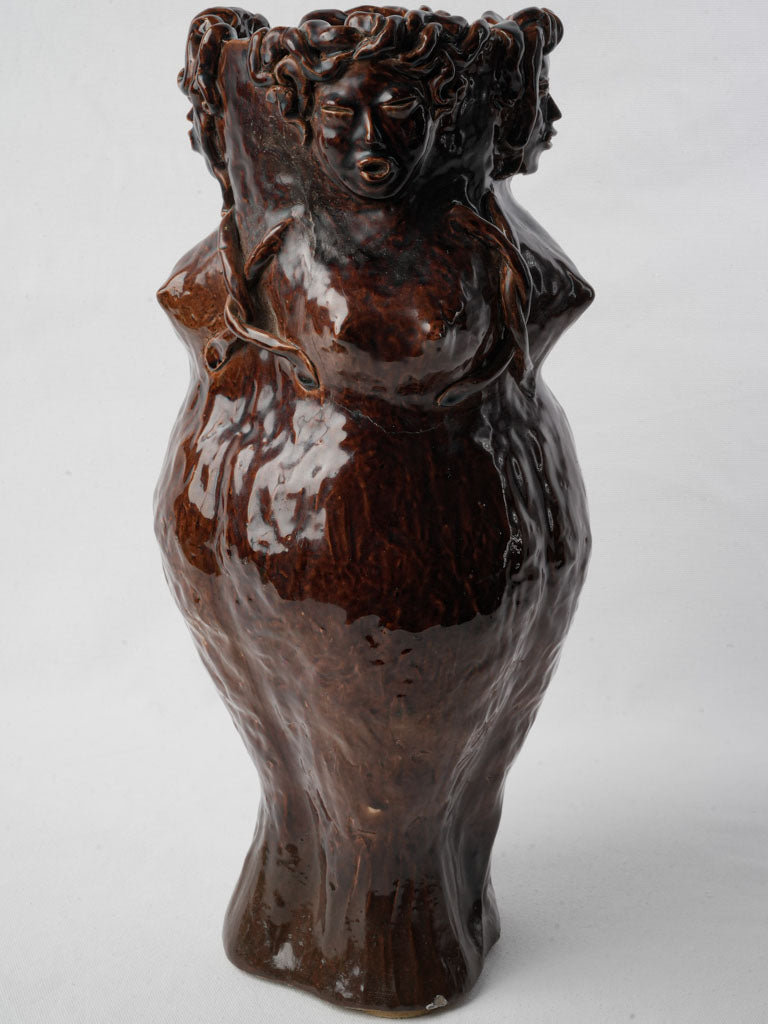 Expressive siren-embellished vase  