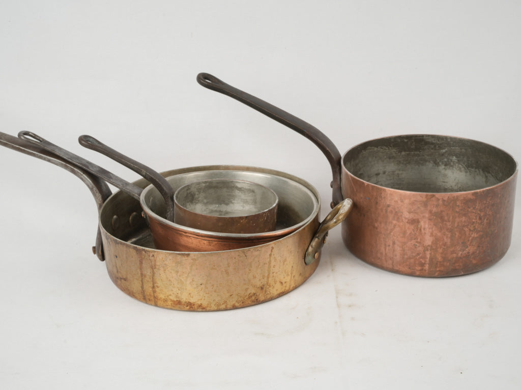 Well-loved vintage French copper pans