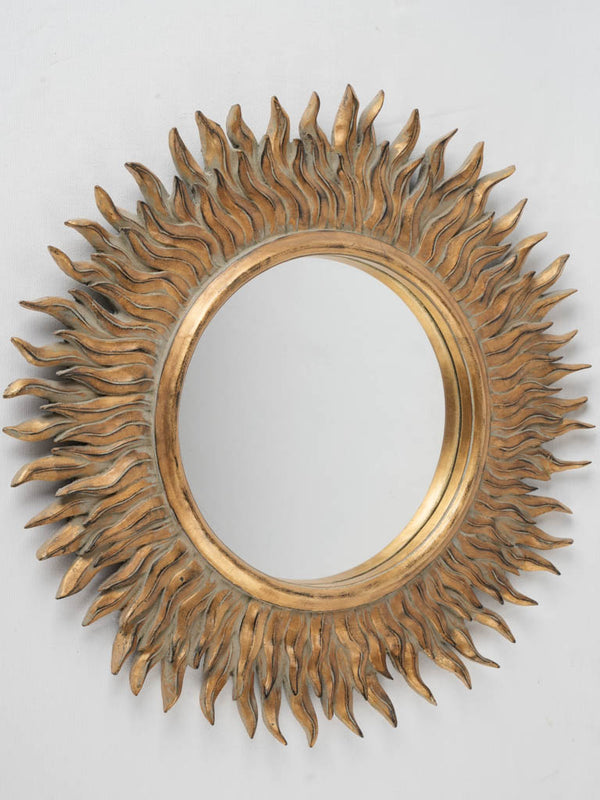 Iconic 1970s/80s sunburst mirror, flame-petal design