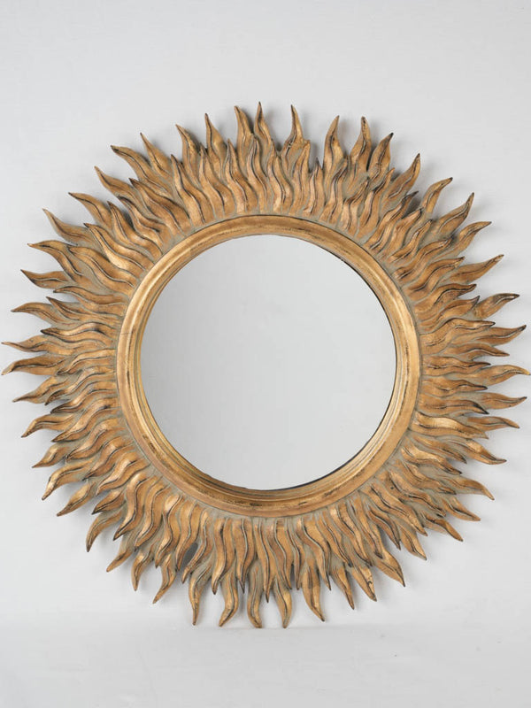 Vintage sunburst mirror with gold-painted, wooden frame