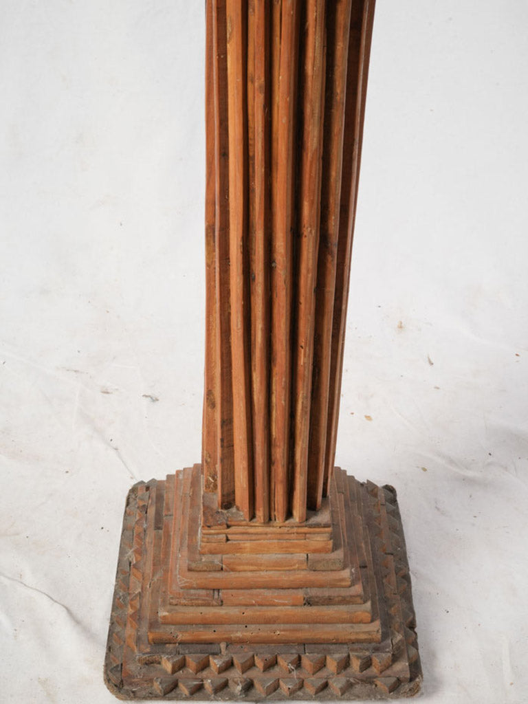 Textured wooden pedestal sculpture