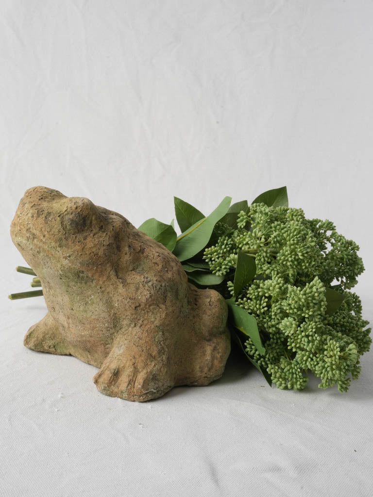 Weathered rustic stone toad statue