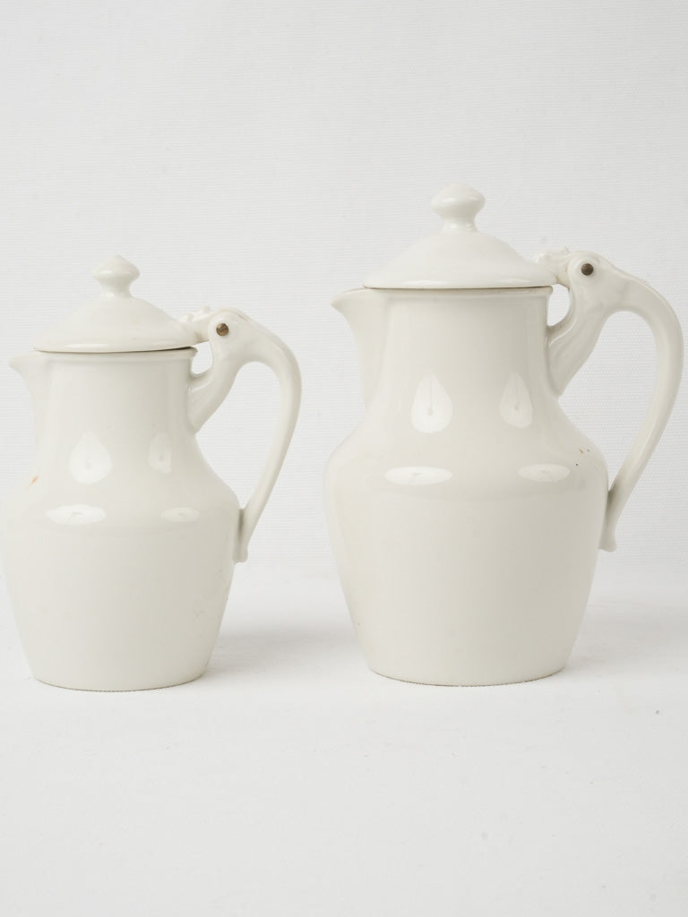 Elegant lidded Limoges porcelain jugs
