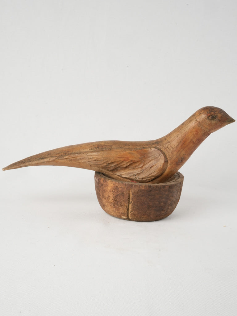 Rustic elongated form bird statue