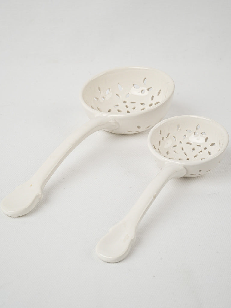 Two pretty slotted ladles - white porcelain