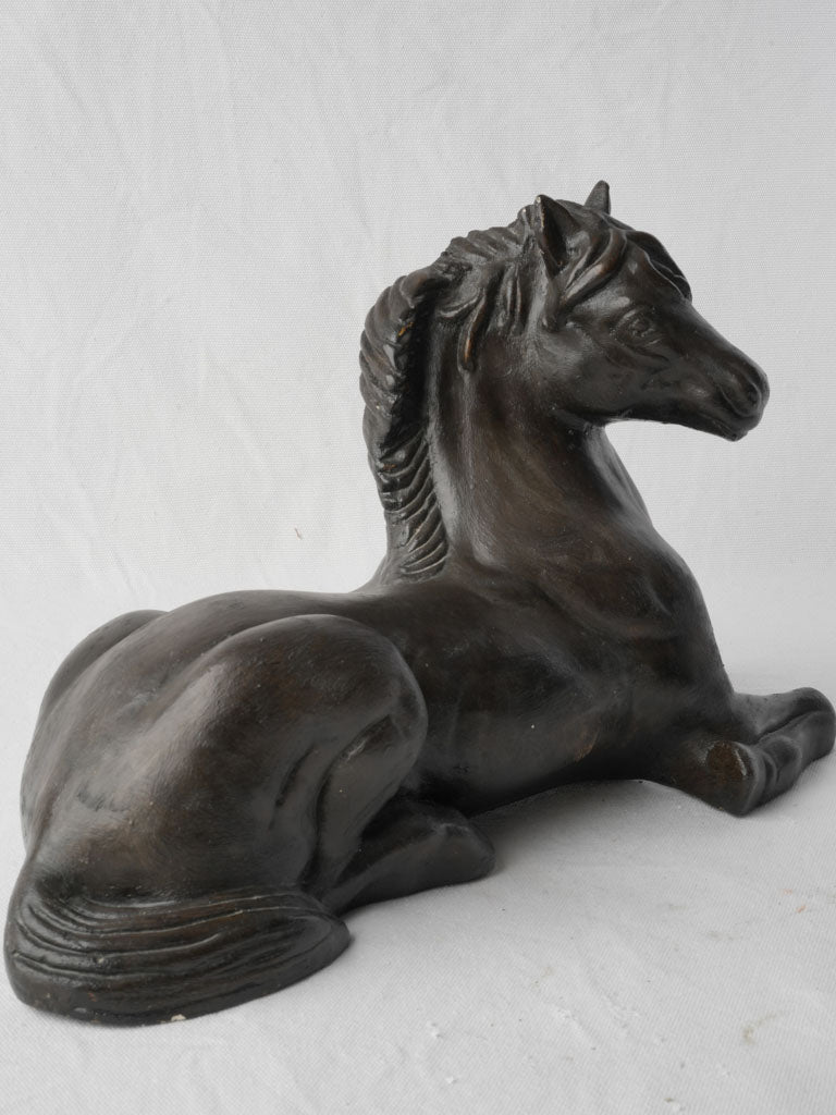 Timeless resting horse sculpture
