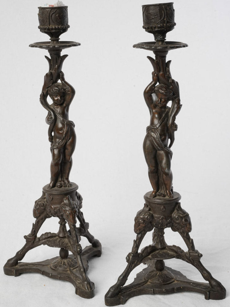 Sculptural bronze-toned candlestick duo  