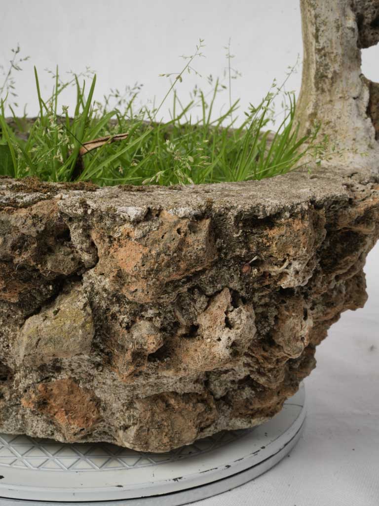 Whimsical arched handle stone jardinière