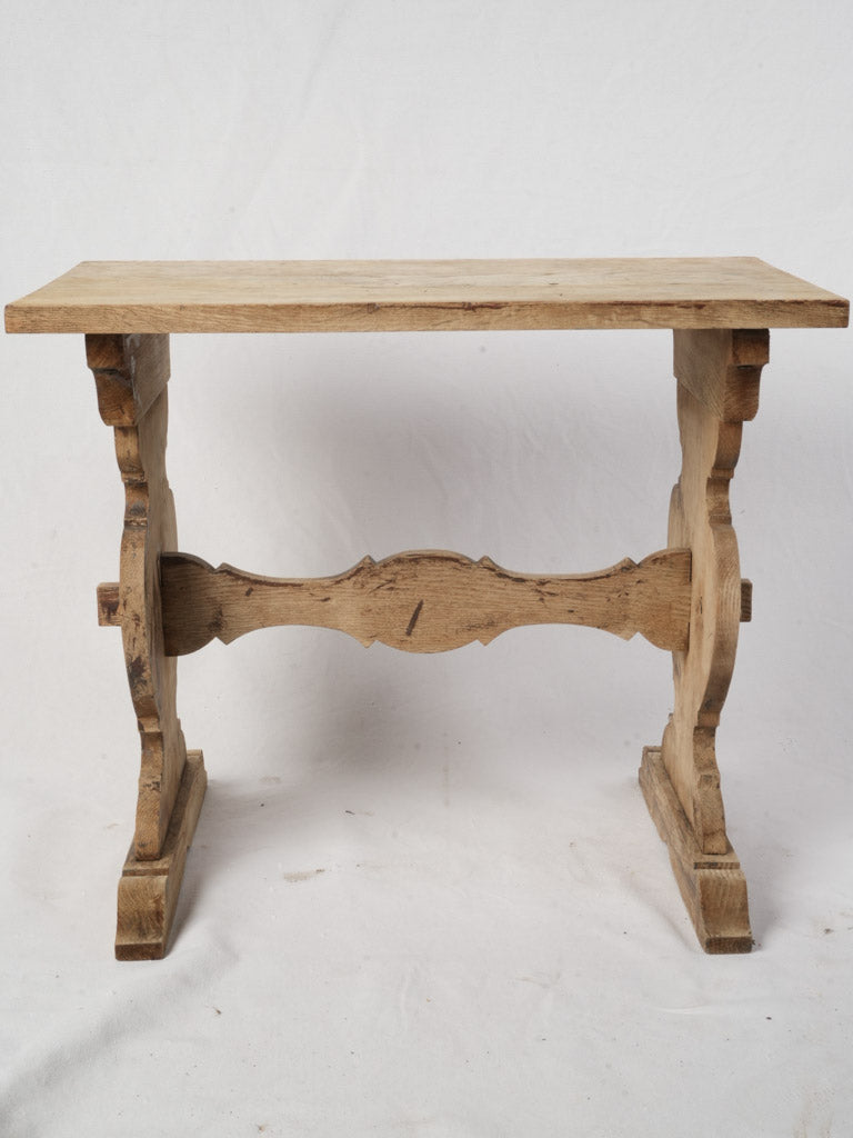 Honey-toned wooden trestle table  