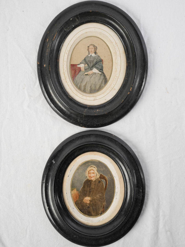 Timeworn ebonized-frame vintage portraits  