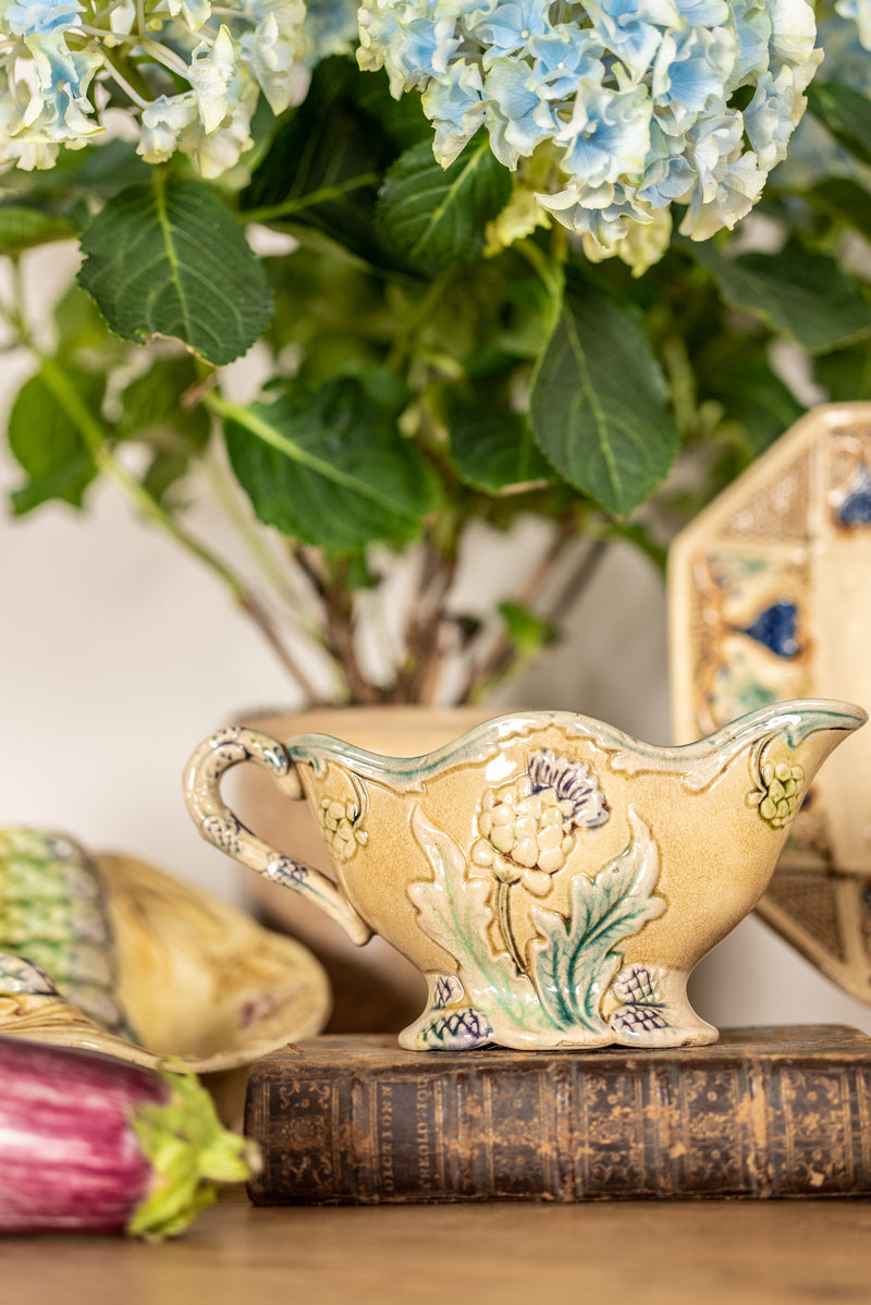 Floral-decorated antique sauceboat Majolica