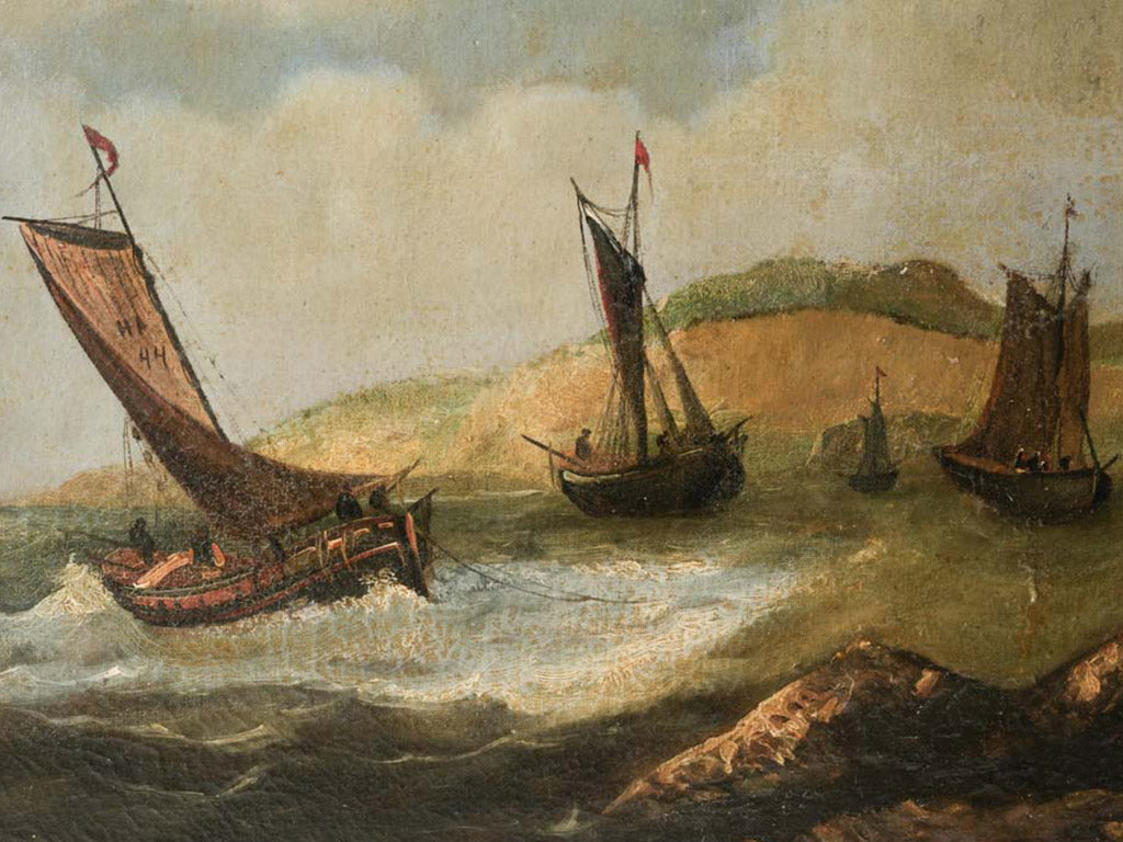 Gilt-framed coastal scene painting
