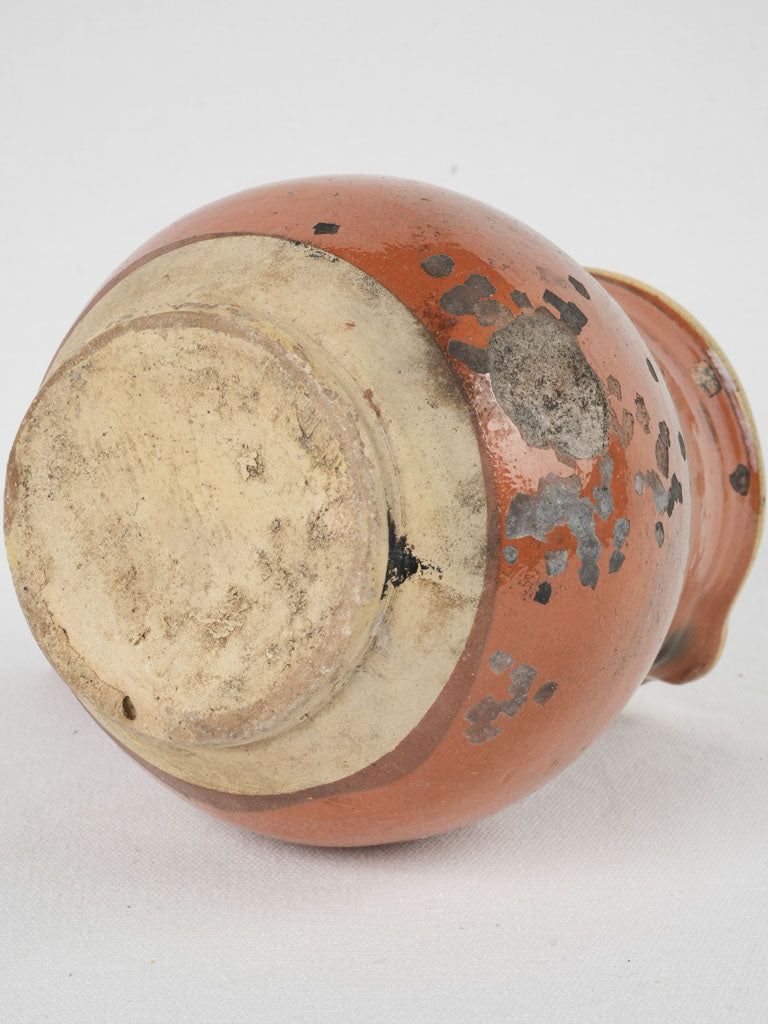 Colorfully glazed antique terracotta pot