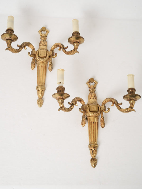 Pair of two-light Louis XVI-style gilded wall sconces