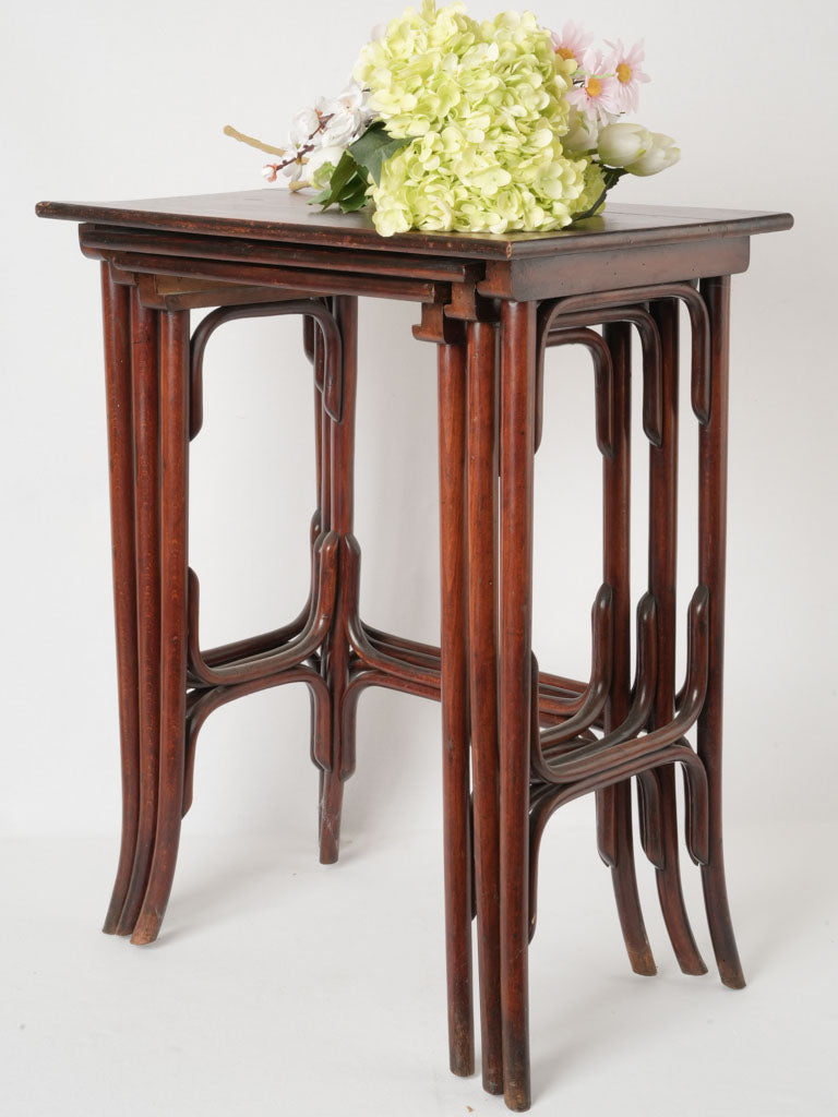 Antique mahogany-finish nesting table trio