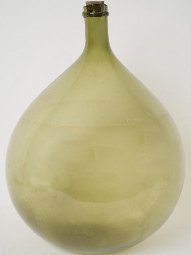 Antique olive green glass demijohn