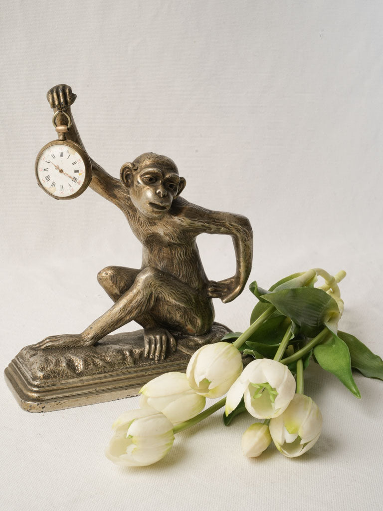 Antique whimsical monkey watch stand