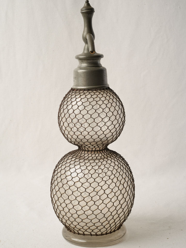 Oxidized pewter-headed siphon bottle  