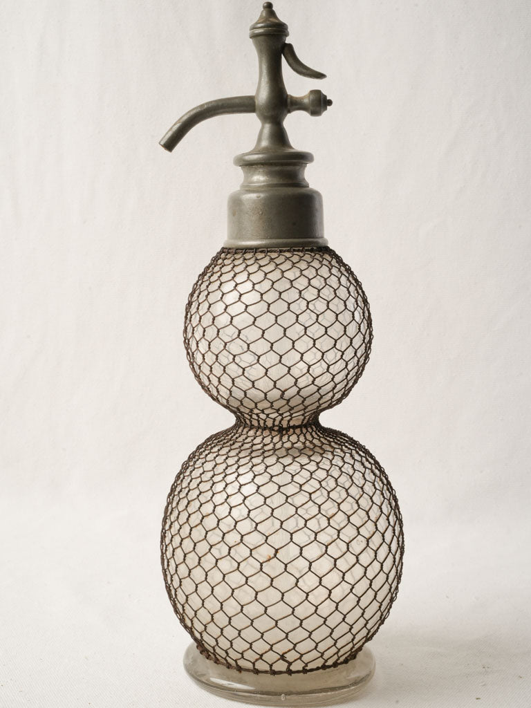 Sculptural vintage wire-caged siphon  