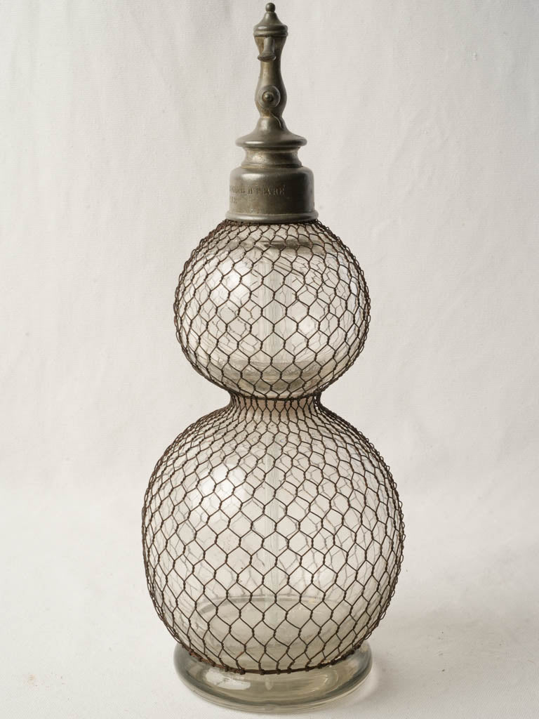 Historical wire-caged soda siphon