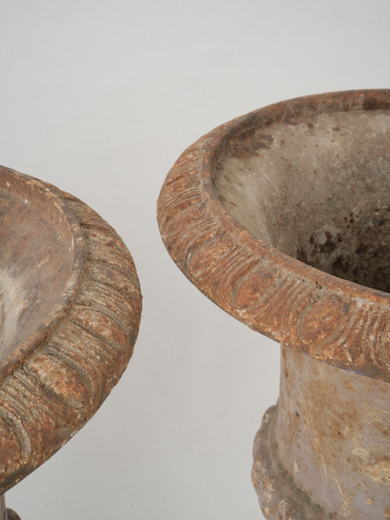 Original riveted base Medici urns  