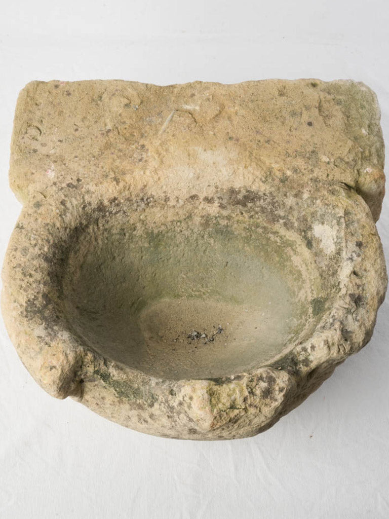 Medieval chalky cream limestone stoup