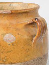 Time-worn earthenware French confit jar