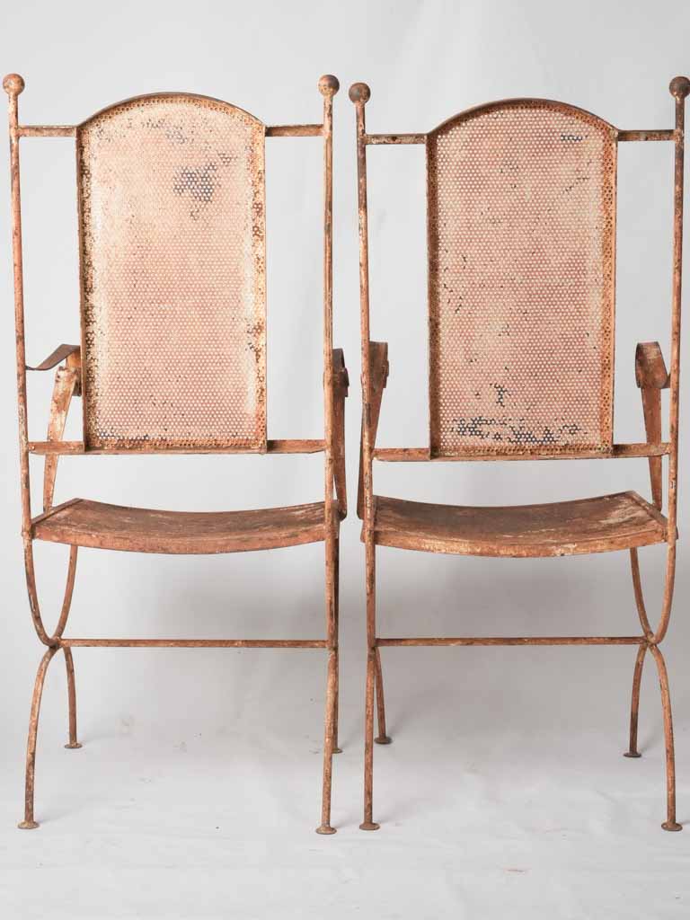 Pair of wrought iron garden armchairs