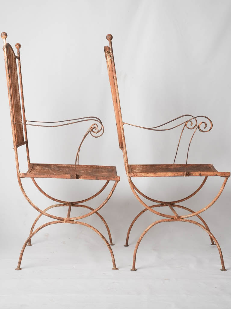 Pair of wrought iron garden armchairs