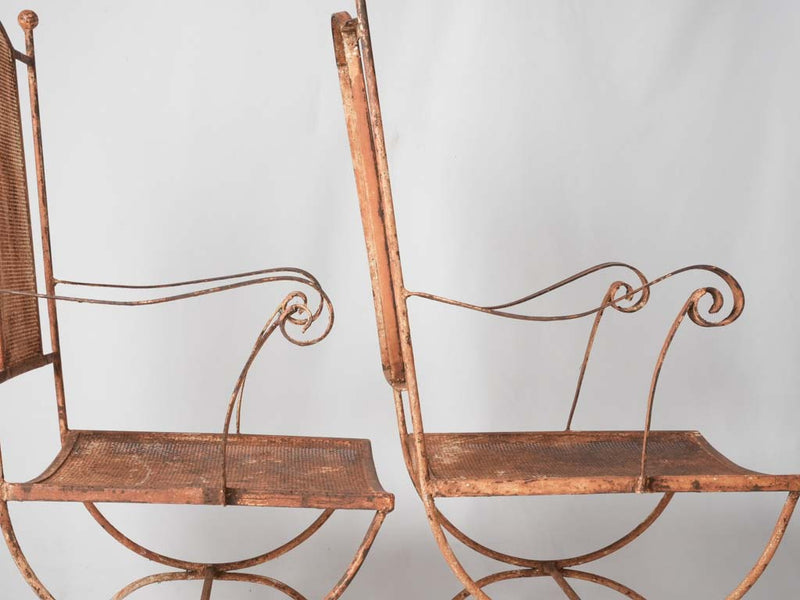 Pair of wrought iron garden armchairs