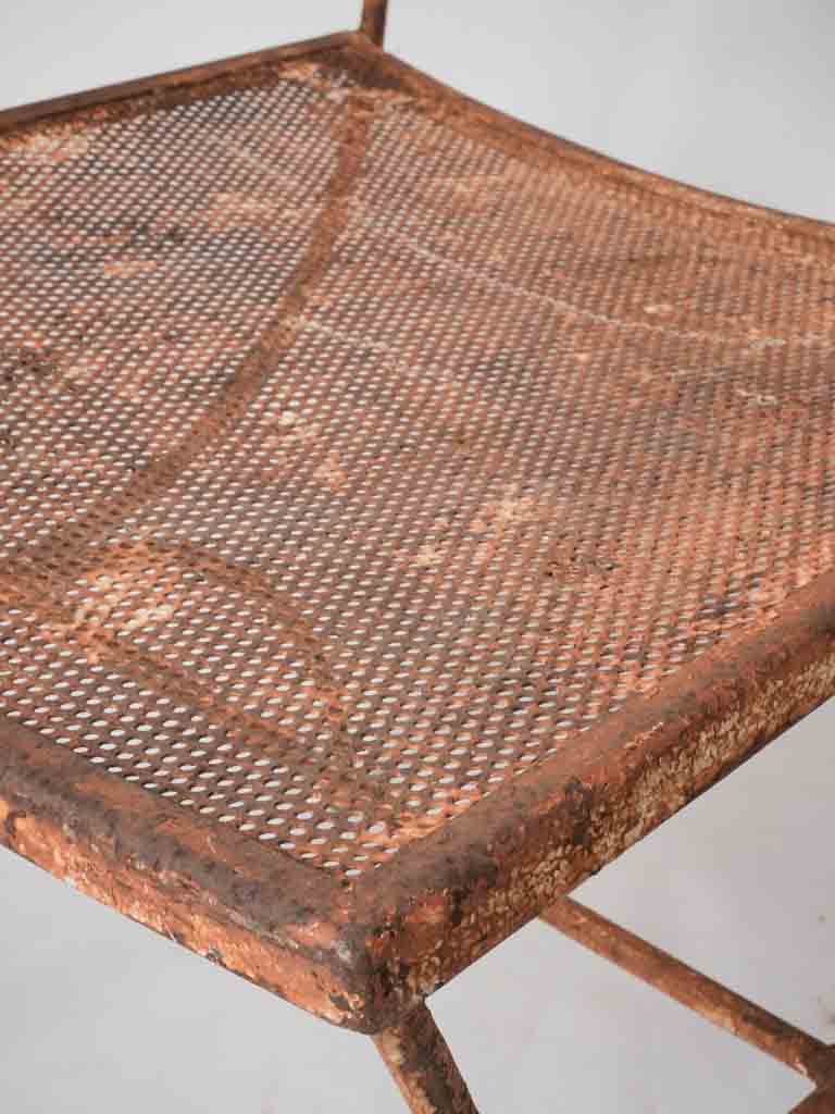 Pair of wrought iron garden armchairs