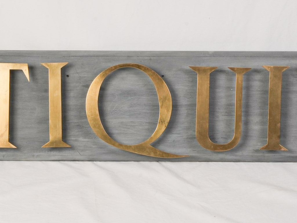 Mid 20th Century French Antiquité Shop Sign in Gilt Brass Letters on Wood - 80¼"