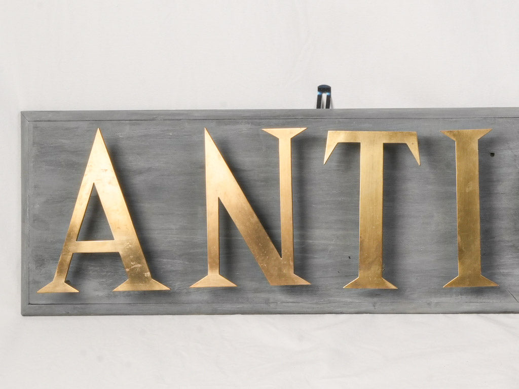 Mid 20th Century French Antiquité Shop Sign in Gilt Brass Letters on Wood - 80¼"