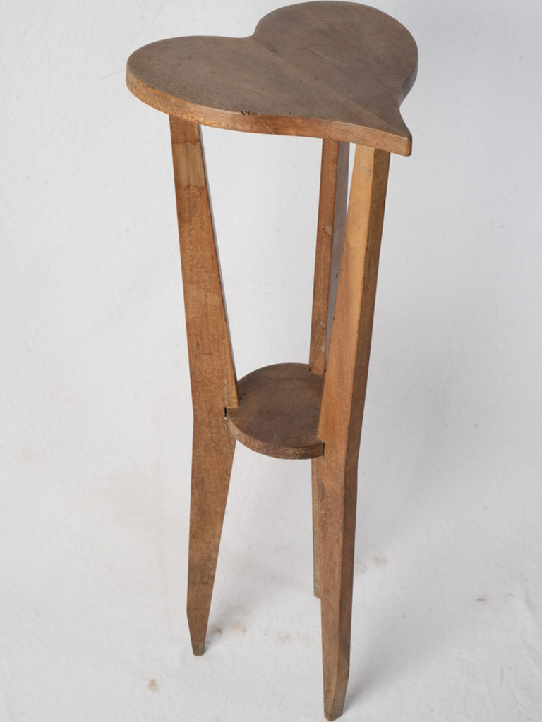 Honey-toned wooden tripod pedestal  